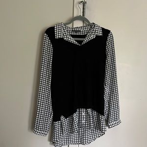 Black and white sweater and button up shirt combined.